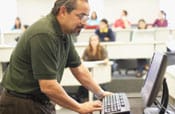 Adult man at computer