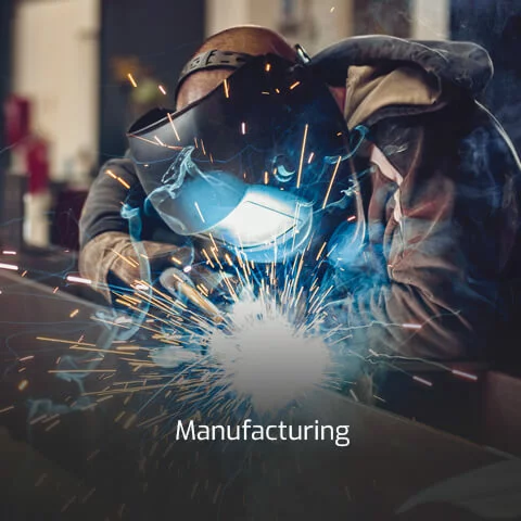 Sparks fly around a manufacturing professional as he works on a project.