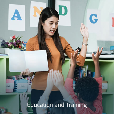 A woman teaching children through the Education program at Broward Technical Colleges.